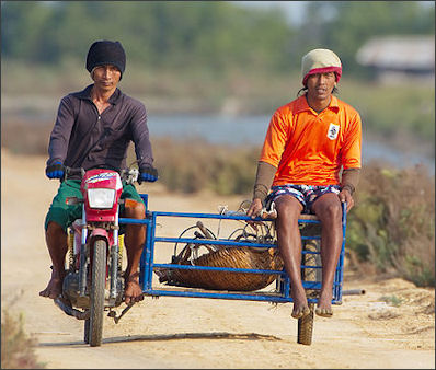 20120514-Salt Farmers on motorbike in Pakistan.jpg